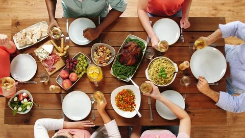 Group of people eating and drinking wine at table Stock Footage 82340802
