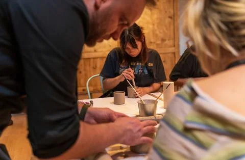 Group of People Engaged in Creative Pottery Workshop Stock Photos