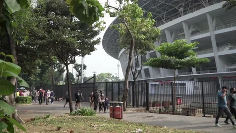 Group of people exercising in the outer course of Bung Karno Stadium Stock Footage 160236411