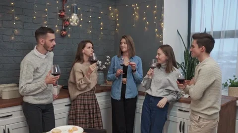 A group of people at a festive event drinks wine. They talk and laugh Stock Footage 151623060