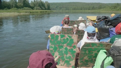 Group of people on float boat. Back view. People pull oars Stock Footage 121774150