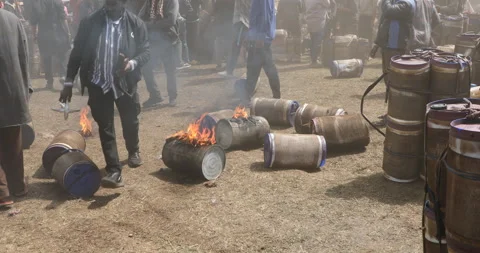 Group of people gather a powerful explosion storage containing cannabis oil cans Видео 326980459