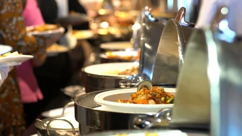 Group of people hand grab buffet food in hotel restaurant Stock Footage 100050147