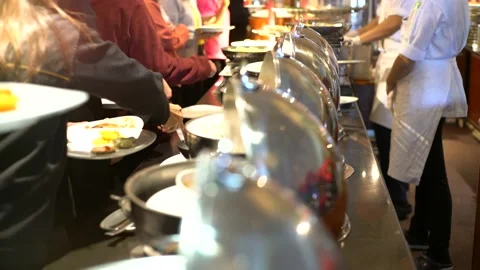 Group of people hand grab buffet food and drink in hotel restaurant Stock Footage 148894124