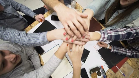 Group of people having creative meeting in an office. all cheering with hands up Stock Footage 114360156