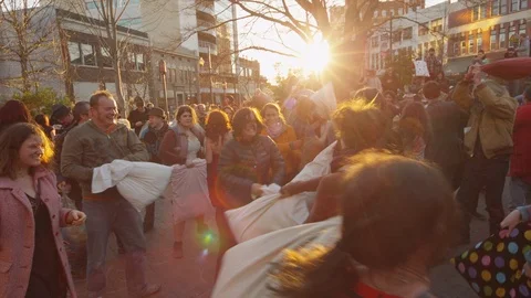 Group of people having fun during the pillow fight festival, medium shot Stock Footage 103421792