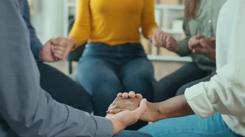 A Group of People Join Hands in a Circle During a Group Therapy Session. Stock Footage 166845080