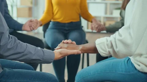 A Group of People Join Hands in a Circle During a Group Therapy Session. Stock Footage 166845145