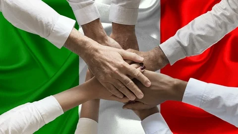 Group of people joining hands over waving italian flag	 Stock Footage 122393541