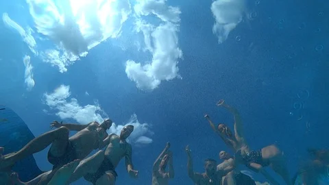 A group of people jumping into the pool. Stock Footage 98393478