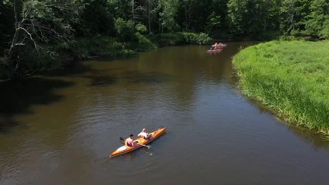 A group of people kayaking on the river Stock Footage 112375951