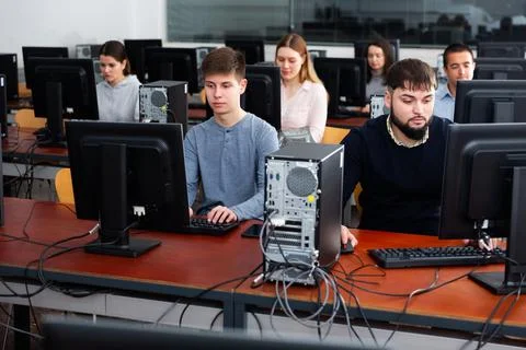 Group of people learning to use computers in classroom 写真素材