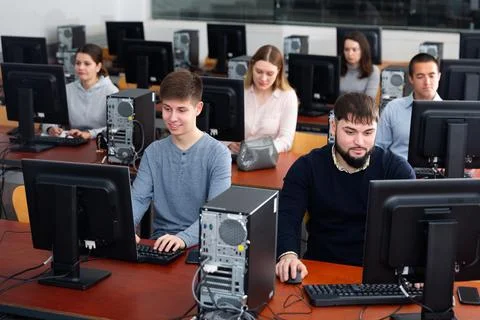Group of people learning to use computers in classroom 写真素材