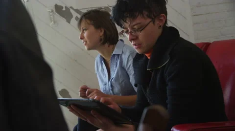 Group of people looking at tablet Stock-Footage 61676196