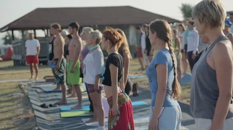 A Group of People Making Deep Breathing With eyes closed. Lesson of yoga on the Stock Footage 60704804