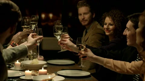 Group of people making a toast at a restaurant. Stock Footage 61158028