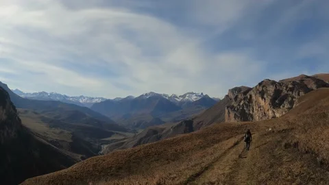 A group of people is moving through a mountainous area Stock Footage 171956761
