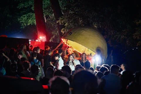 Group of people at a party with lights in the background 库存照片