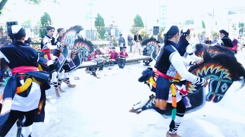 Group of people performing Kuda Lumping dance Stock Footage 124323845