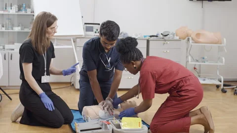 Group of people practicing CPR on a dummy Video stock 278461526