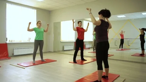 A group of people practicing exercises of gymnastics in sports hall. HD Stock-Footage 73119663