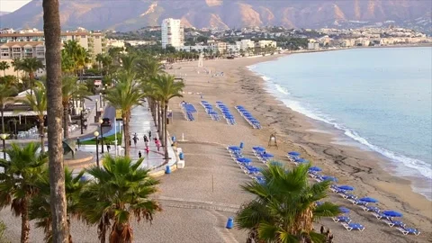 Group of people practising yoga early in the morning on the beach at Altea Spain Stock Footage 175923106