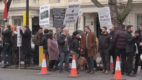 Group of people protesting at streets for stunts near BAFTA - London 2020 Stock Footage 125800174