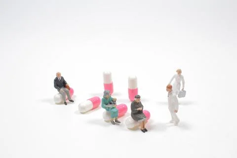 The Group people queue up to wait for the doctor. 스톡 사진