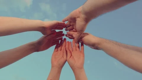 Group people raise hands sky, join palms together close-up. Team spirit, holds Stock Footage 267768697