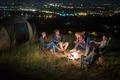 The group of people rest on the nature and make a barbecue. Wide angle Photo