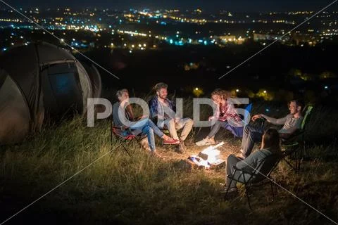 The group of people rest on the nature and make a barbecue. Wide angle Stock Photos
