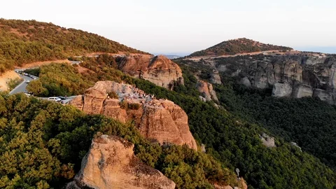 Group of people on rocks sunset time Video stock 106946137