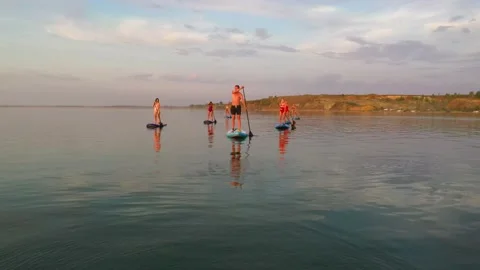 Group of people rowing simultaneously on EPS boards Stock Footage 135262095