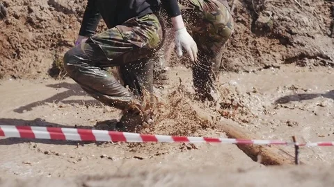 A group of people running through mud pit in obstacle endurance race Stock Footage 75261992