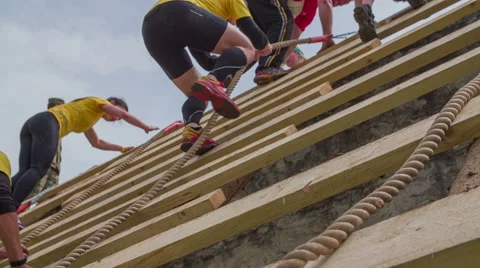 Group of people running through obstacle course Stock Footage 40711301