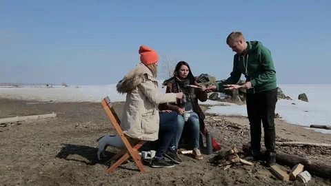 A group of people sitting around the campfire. backpacking Stock Footage 74953417