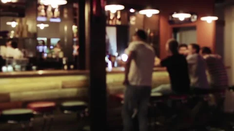 Group of people is sitting in a bar, Defocused background Video stock 65215083