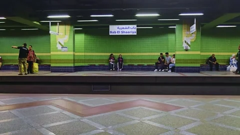 A group of people sitting on a bench in a subway station Stock Footage 292283541