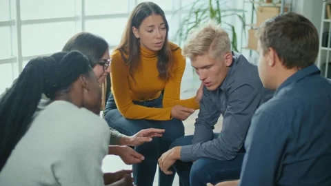 A Group Of People Sitting in a Circle During a Group Therapy Session. Depression Stock Footage 166841607