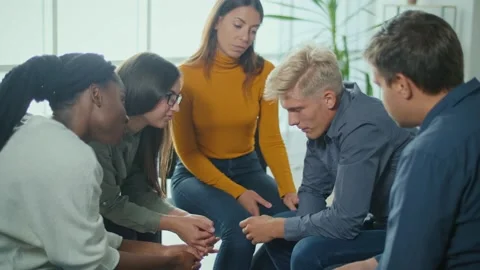 A Group Of People Sitting in a Circle During a Group Therapy Session. Depression Video stock 166841748