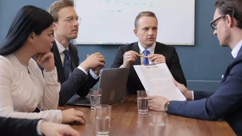 A group of people sitting at a table Stock Footage 130054709