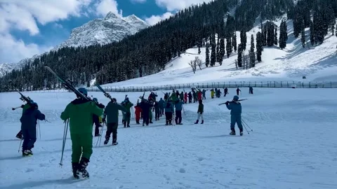 Group of people skiing and snowboarding down the ski slope. Stock Footage 277245053