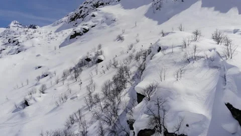 Group of people skiing down the mountain valley. Epic free ride scene. Stock Footage 150680469