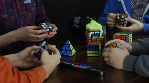 Group of People Solving Rubik's Cube Stock Footage 49931112
