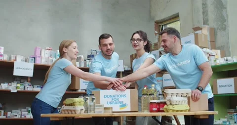 Group of people stacking hands together for showing unity and teamwork while Video stock 193987737
