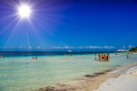 Group of people standin in the water beach on a sunny day in Cancun, Yukatan, Stock Photos