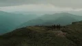 The group of people standing on a beautiful mountain peak 4k or 4k+ Resolution