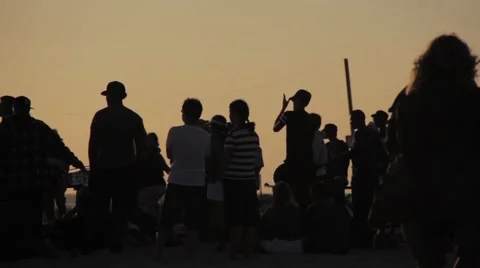 Group of people at sunset, clapping, drumming Stock Footage 56343962