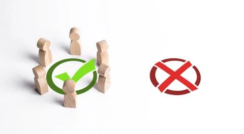 A group of people surrounded a green checkmark, ignoring the red X. The right Stock Photos
