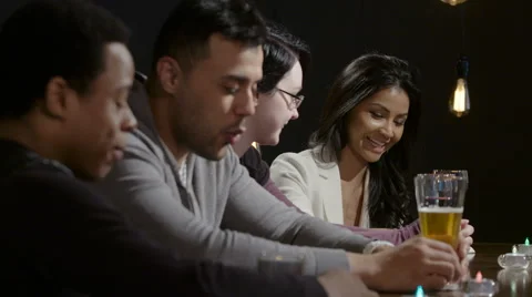 Group of people talking at a bar Stock Footage 62689824